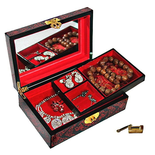 Boîte à bijoux originale 'lotus' rouge ouverte, plateau supérieur déposé avec bijoux